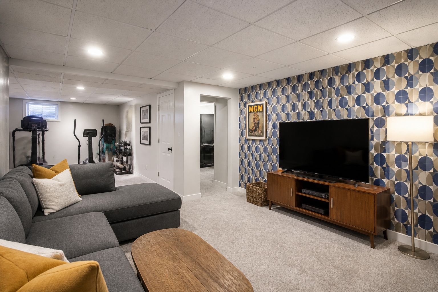 Retro geometric wallpaper in a finished basement family room