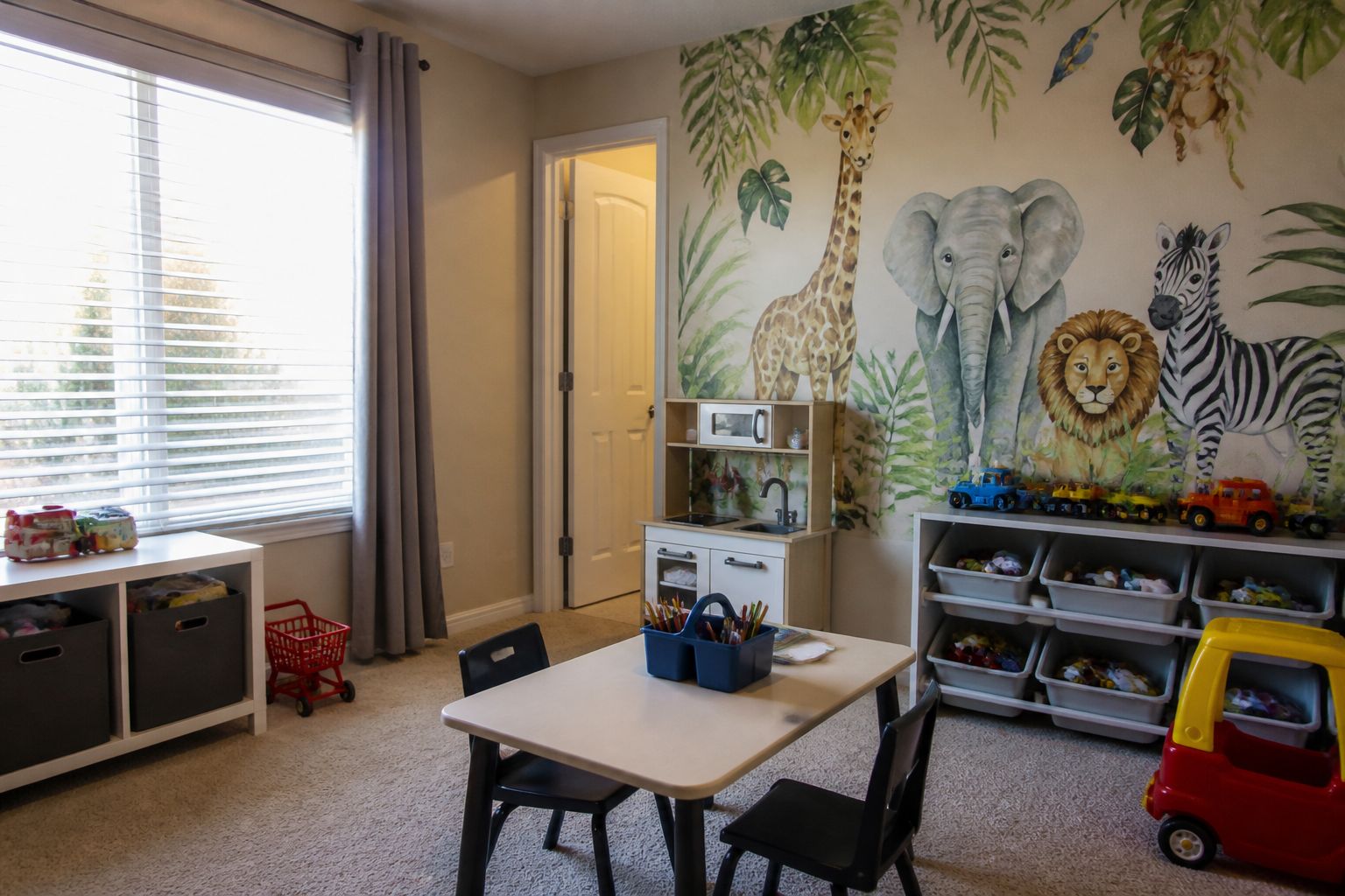 Safari animal mural wallpaper in a kids playroom